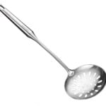Stainless steel slotted spoon on a white background.