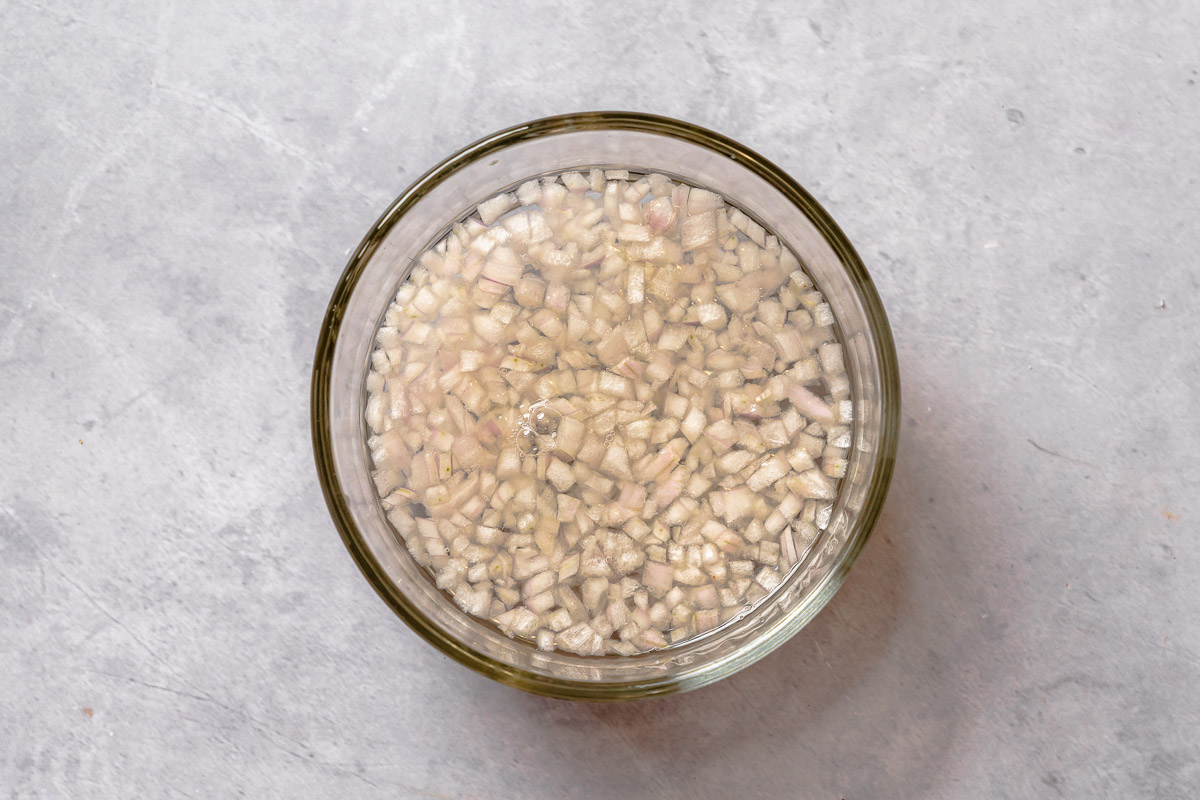 Raw minced shallot soaking in water.