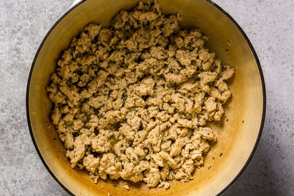 Cooked ground chicken in a Dutch oven.